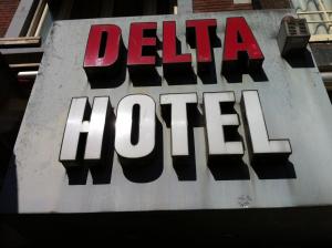 a sign for a delica store on a building at Delta Hotel City Center in Amsterdam