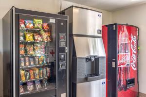 a refrigerator and a soda vending machine in a room at Motel 6 Chattanooga Downtown in Chattanooga