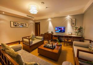 โทรทัศน์และ/หรือระบบความบันเทิงของ Fliport Garden Hotel Wuyishan