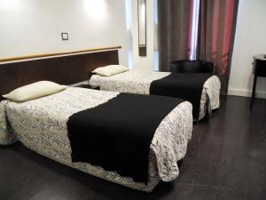 Postel nebo postele na pokoji v ubytování Camelia Prestige - Place de la Nation