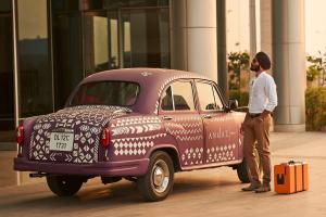 a man standing in front of a white truck at Andaz Delhi Aerocity- Concept by Hyatt in New Delhi
