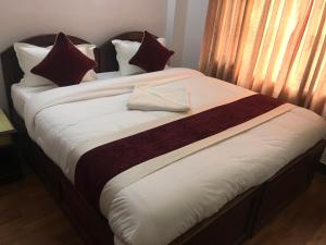 Postel nebo postele na pokoji v ubytování Hotel Lily