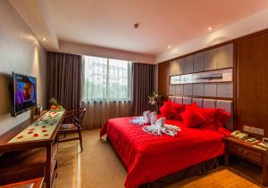 โทรทัศน์และ/หรือระบบความบันเทิงของ Fliport Garden Hotel Wuyishan