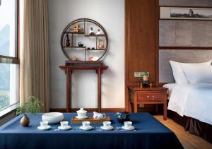 เตียงในห้องที่ Fliport Garden Hotel Wuyishan