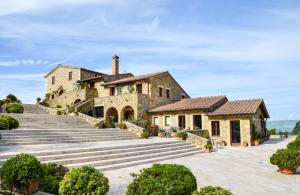 an estate with a staircase leading up to a building at Podere Perelli in Castiglione dʼOrcia