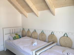 Postel nebo postele na pokoji v ubytování Zatoka Mew