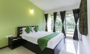 Postel nebo postele na pokoji v ubytování Treebo Laa Gardenia Resort, Nilavoor Lake + 22 fotografií