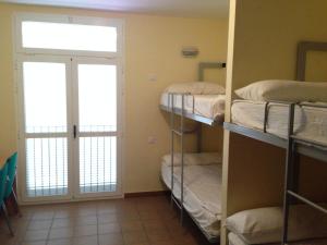 Postel nebo postele na pokoji v ubytování Albergue De Puntas De Calnegre