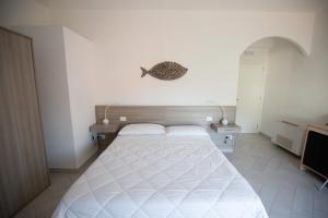 Postel nebo postele na pokoji v ubytování La Conchiglia sul Mare