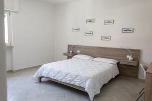 Postel nebo postele na pokoji v ubytování La Conchiglia sul Mare