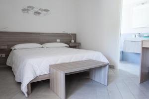 Postel nebo postele na pokoji v ubytování La Conchiglia sul Mare