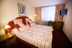 Un pat sau paturi într-o cameră la Skandinavia Country Club and SPA