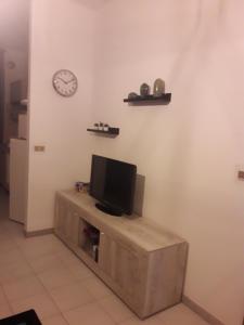 TV a/nebo společenská místnost v ubytování B&B L'ARANCIO