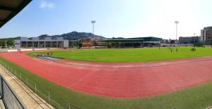 a large stadium with people on a running track at Hotel Xaine Park in Lloret de Mar