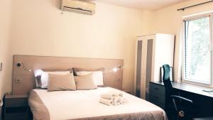 Cama o camas de una habitación en Malavi top center studio Ruse! Comfort&clean!