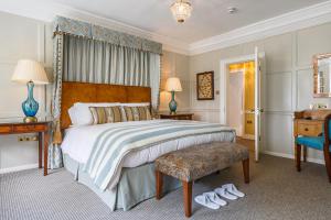 a bedroom with a bed and a desk and a chair at The Assembly House in Norwich