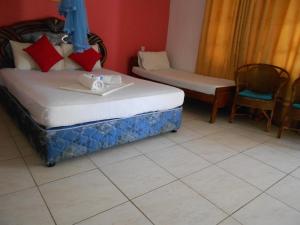 Postel nebo postele na pokoji v ubytování Shanith Guesthouse Negombo