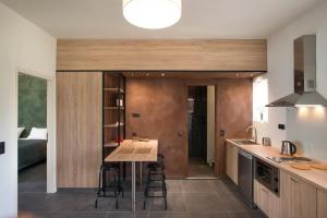 a kitchen with a table in the middle of a room at Pelagia Sea Side in Acharavi +104 photos