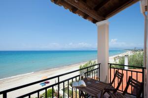 a balcony with a view of the beach at Pelagia Sea Side in Acharavi