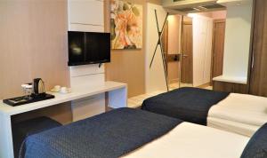 Postel nebo postele na pokoji v ubytování Extenso Hotel