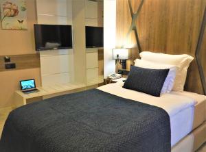 Postel nebo postele na pokoji v ubytování Extenso Hotel