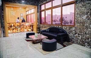 a living room with a couch and a table at Hôtel IMAN in Nouakchott