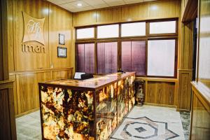 a lobby with a reception desk in a building at Hôtel IMAN in Nouakchott