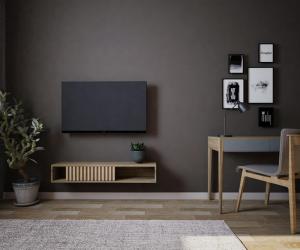 a living room with a flat screen tv on a wall at North Avenue Loft Apartments in Yerevan