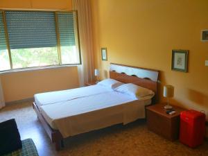 Postel nebo postele na pokoji v ubytování B&B Il Parco Dei Pini