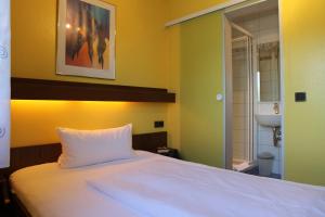 Voodi või voodid majutusasutuse Hotel Ricci toas
