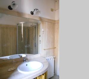 a bathroom with a white sink and a shower at b&b Gio Colosseo - Celio in Rome