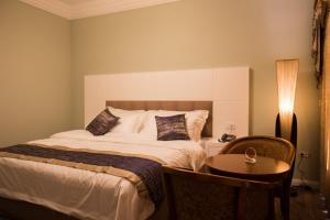 Postel nebo postele na pokoji v ubytování Hotel Britania