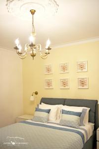 Uma cama ou camas num quarto em Alecrim Rosmaninho Guest House