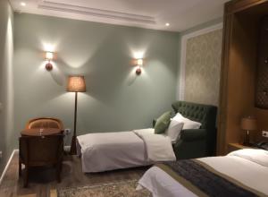 Postel nebo postele na pokoji v ubytování Hotel Britania