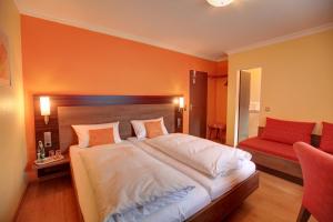 Un pat sau paturi într-o cameră la Hotel Ricci
