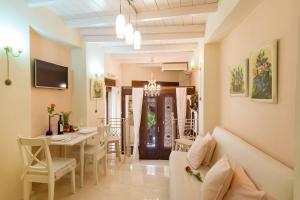 a living room with a couch and a table at RETRO 51 in Rethymno Town