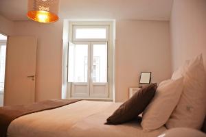 Uma cama ou camas num quarto em Fullest Apartments