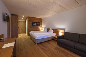 Postel nebo postele na pokoji v ubytování Hotel Reuti