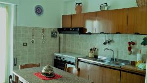 Kuchyň nebo kuchyňský kout v ubytování La Casa sul Corso