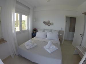 Letto o letti in una camera di Paliouri Sea Lounge by Luxlikehome