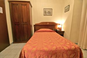 Letto o letti in una camera di Hotel Pavone