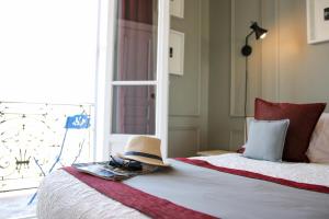 Postel nebo postele na pokoji v ubytování Le Panoramic Boutique Hôtel