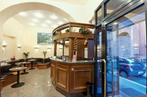 a salon with a car parked in a room at Hotel Pavone in Milan