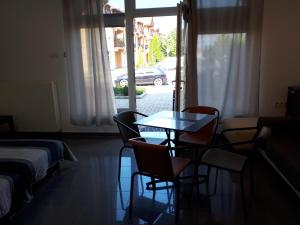 A bed or beds in a room at Kertvárosi Apartman II