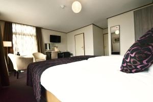 Postel nebo postele na pokoji v ubytování Hotel Faber