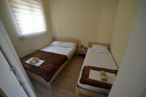 Ein Bett oder Betten in einem Zimmer der Unterkunft Apartmani MV