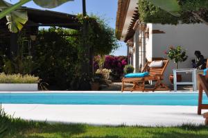 a swimming pool in the yard of a house at Casa Silca in Marbella