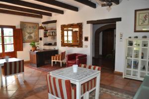 a living room with a table and chairs at Casa Silca in Marbella