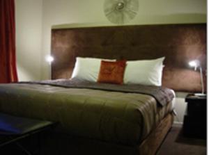 Ένα ή περισσότερα κρεβάτια σε δωμάτιο στο Terra Vive Suites & Apartments