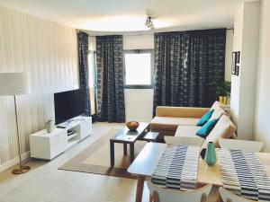 Televízia a/alebo spoločenská miestnosť v ubytovaní New apartment in San Juan Playa, Alicante PAU5